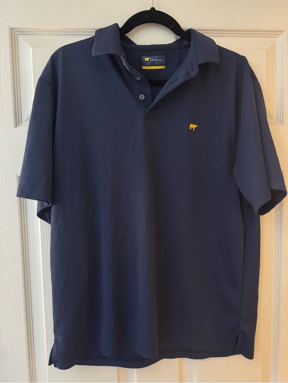 Men's Jack Nicklaus Navy Polo Shirt with Small Yellow Bear Logo